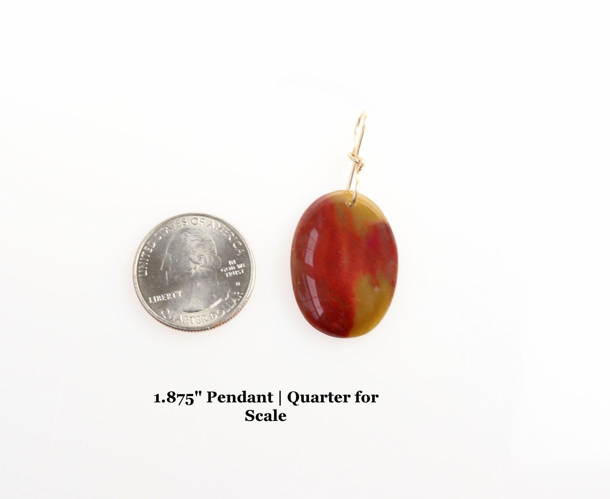 A 1.875 inch sonoran sunrise pendant shown next to a u.s.a. quarter for size and scale.