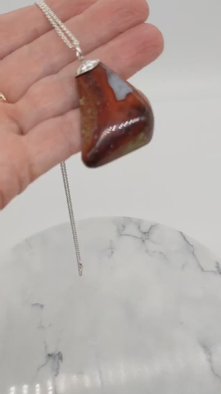 A demo of a Chunky red Jasper Agate pendant with Argentium® silver bail, ideal as a bold focal for wire wrapping or artisan jewelry design.