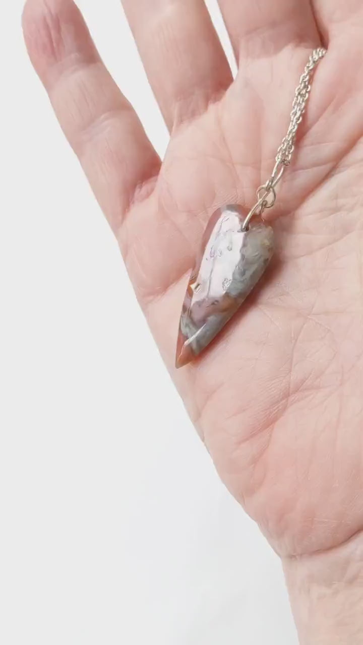 Crazy Lace Agate Pendant Demonstration of features with chain.