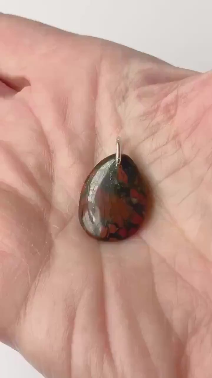 Red Brecciated Jasper Teardrop demo of features in hand.