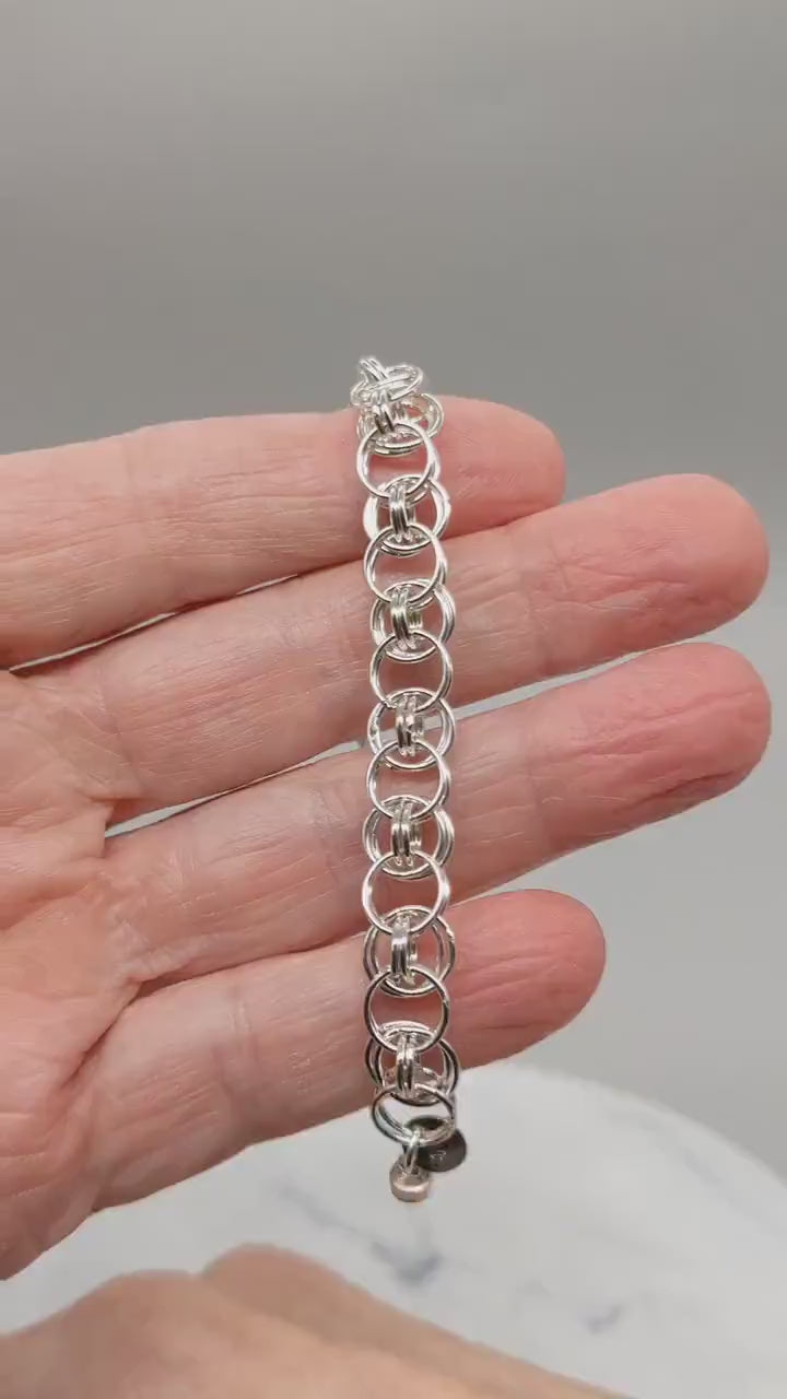 Video demo of helm chain bracelet features by human hand.