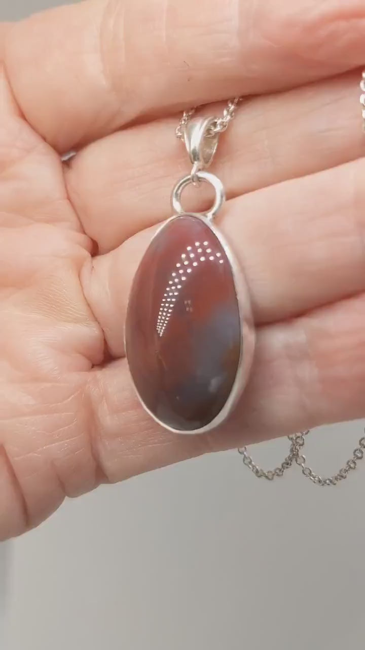 Video demonstrating the features of the Rainbow Wood Pendant and chain.