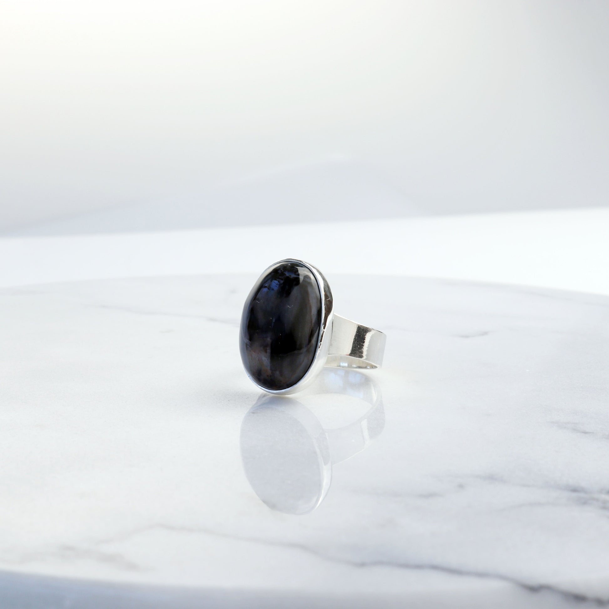 Side profile of handmade rainbow wood gemstone ring for men