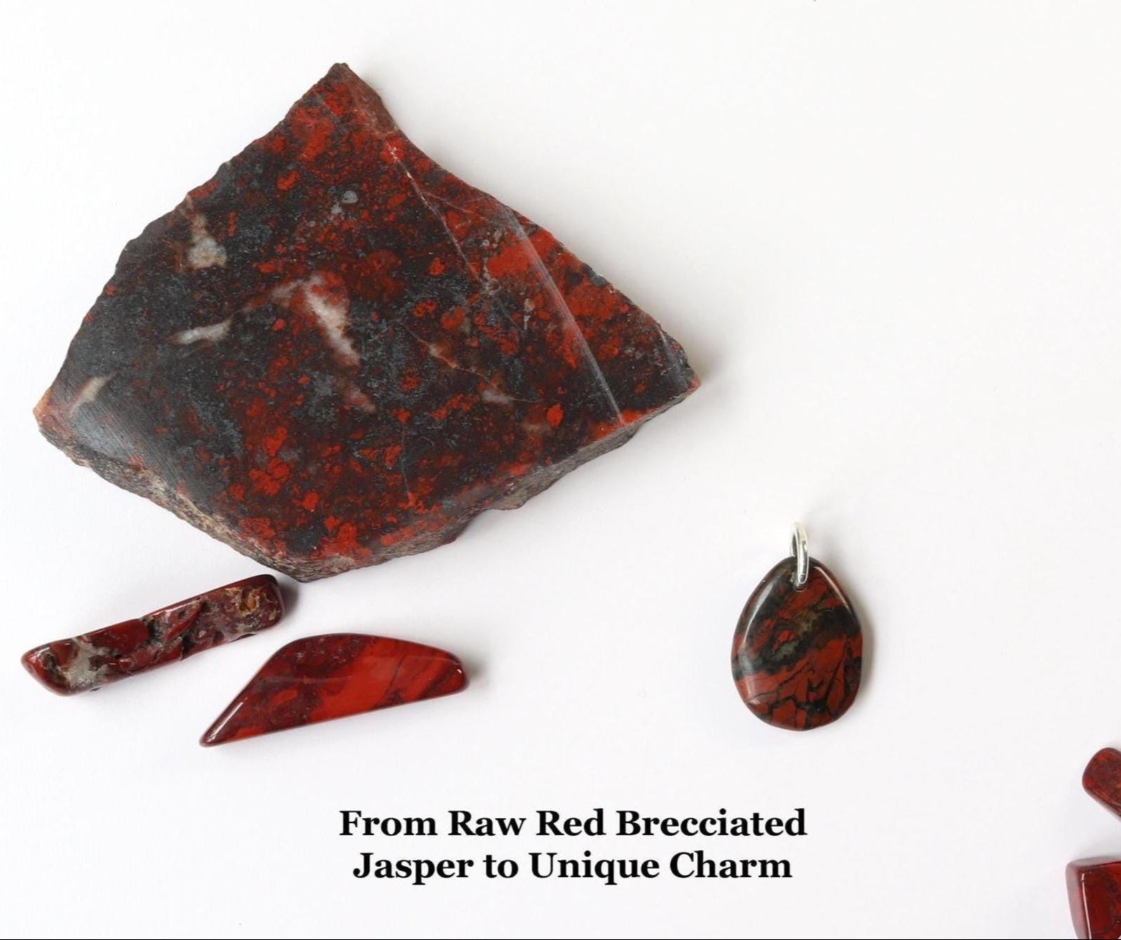 From Raw Red Brecciated Jasper to Unique Charm.  Raw Red Brecciated Jasper stone with natural red, brown, and black veining – source material for handcrafted pendant.