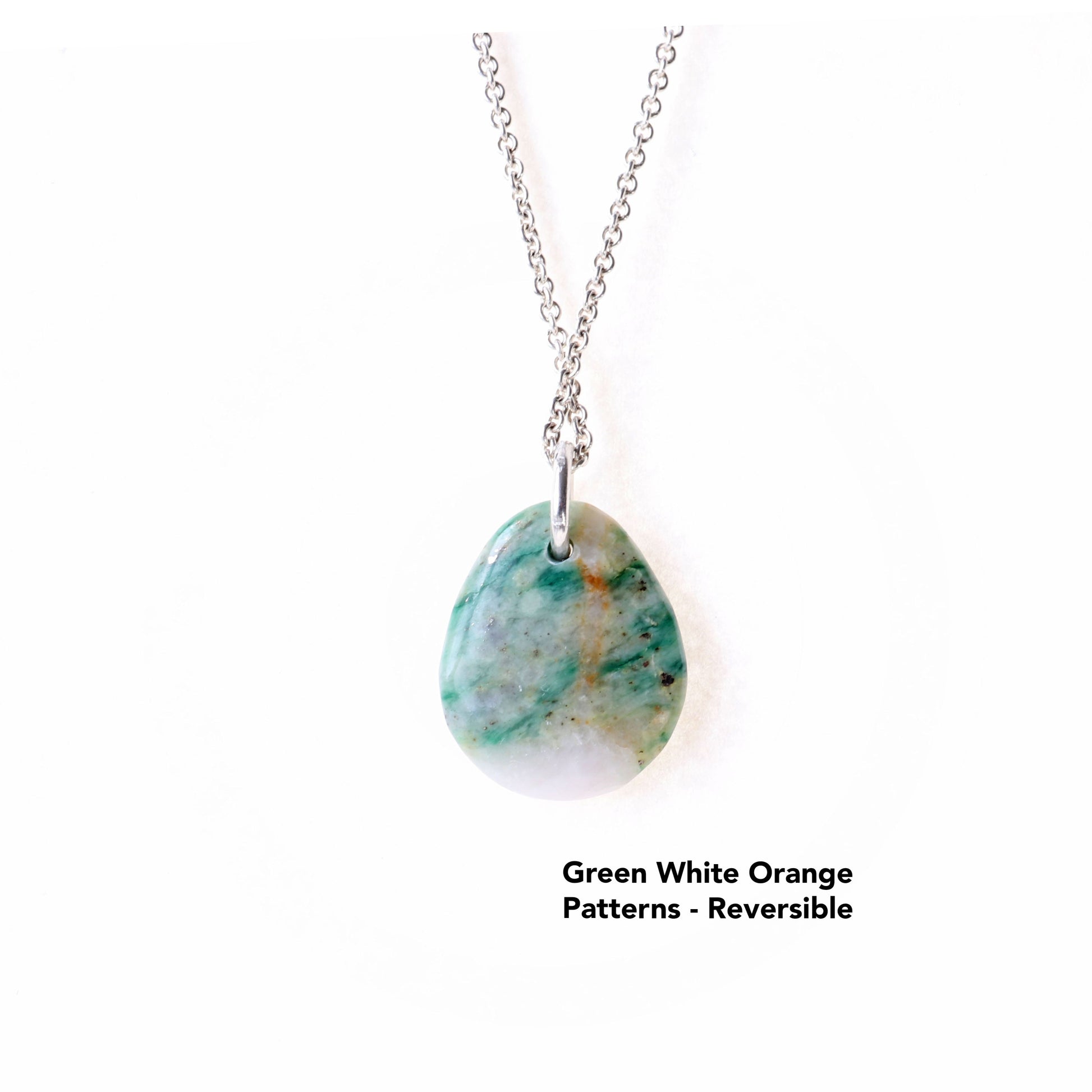This reversible teardrop-shaped Mariposite gemstone pendant charm showcases a vivid blend of green white orange patterns, handcut and polished in our Missouri studio. Complementary chain is in included.
