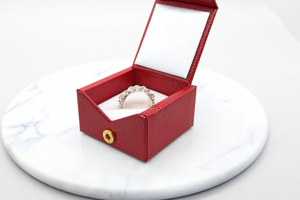 Solid Argentium 935 silver rotating chain ring with handcrafted double cable chain and polished anticlastic band packaged in a red stylish gift box