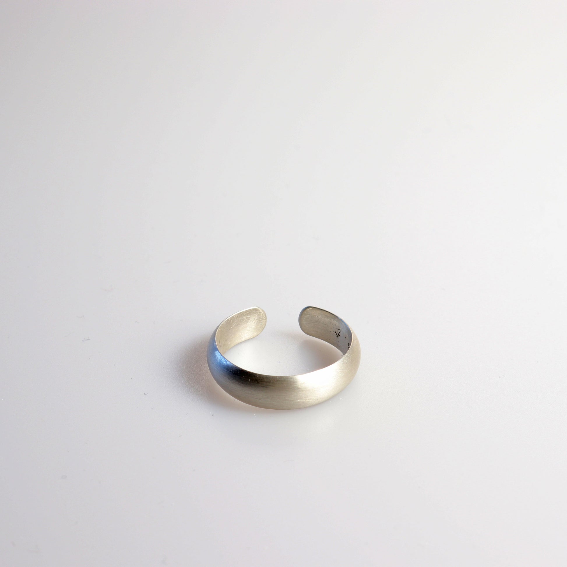 Custom Open Cuff Low Dome Ring in Size 11 from premium 940 Argentium® silver, this ring offers exceptional durability and timeless elegance. The sleek, low dome design features a 6mm width—a standard size for men's bands—with a sophisticated matte finish that delivers a subtle, non-reflective look.