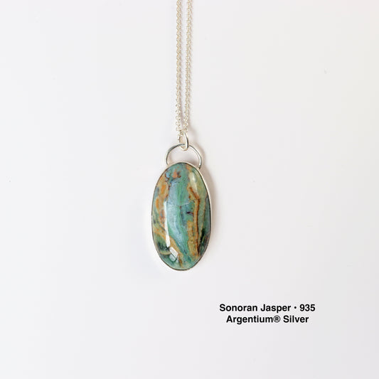 Sonoran Jasper with teal and earthy brown tones. set in  935 Argentium® Silver on white background with Argentium silver necklace chain.