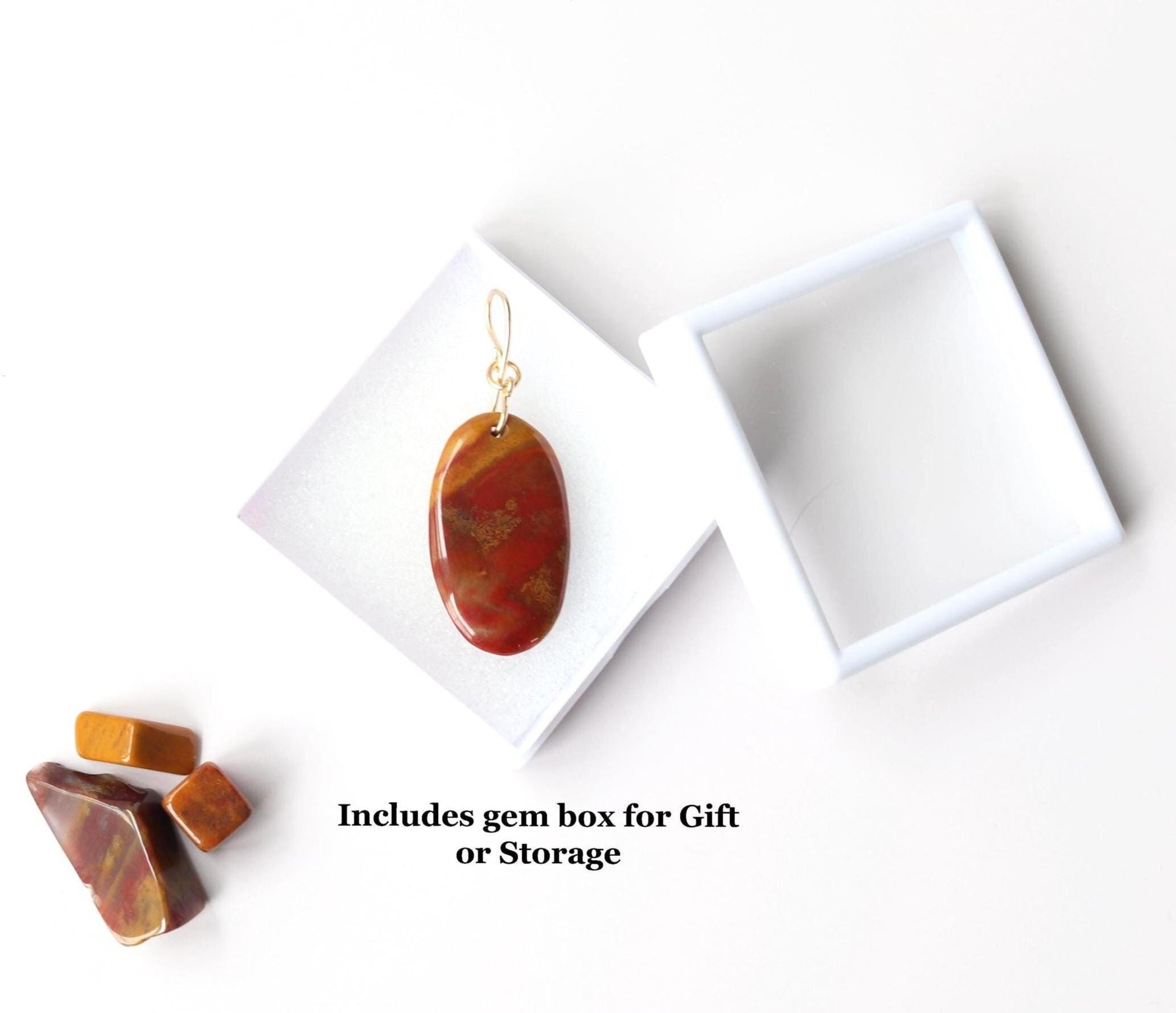 Sonoran Sunrise pendant with deep red and mustard tones, polished on both sides for a smooth, pebble-like feel and comfortable everyday wear.  Ready to gift or store in a gem-box with glass lid.