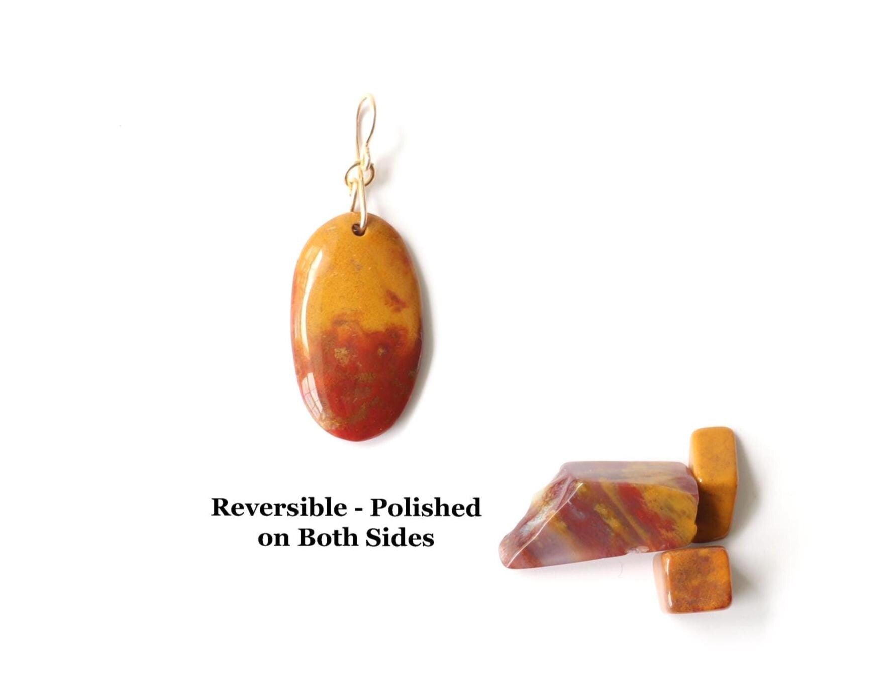 Sonoran Sunrise pendant with deep red and mustard tones, polished on both sides for a smooth, pebble-like feel and comfortable everyday wear.