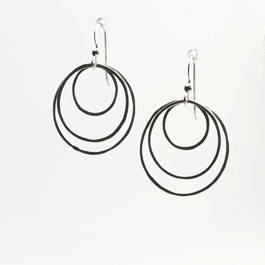 Discover the perfect blend of sustainability and style with our handcrafted hammered hoop earrings. Made from 100% recycled Argentium® 935 silver, these tarnish-resistant earrings are designed to last while maintaining their brilliant finish.