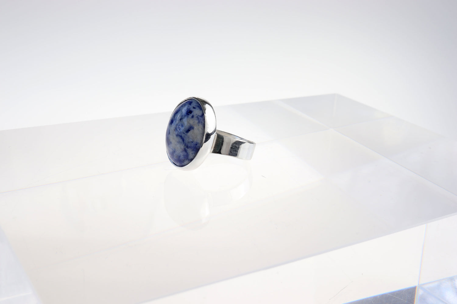 Brazilian Blue Sodalite gemstone has been hand-cut and polished in our Missouri studio to reveal its rich blue tones and natural white veining. Encased in a handcrafted bezel of 935 Argentium® Silver.
