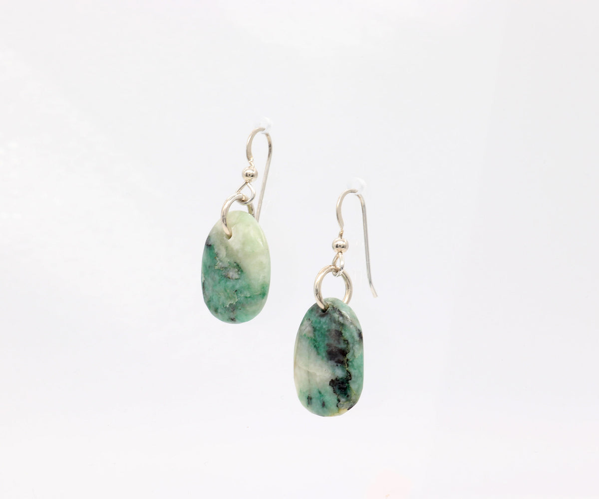 A pair Natural African Turquoise drop earrings in Argentium silver handcut and polished to highlight the green and white marbled natural patterns, shown against a plain white background.