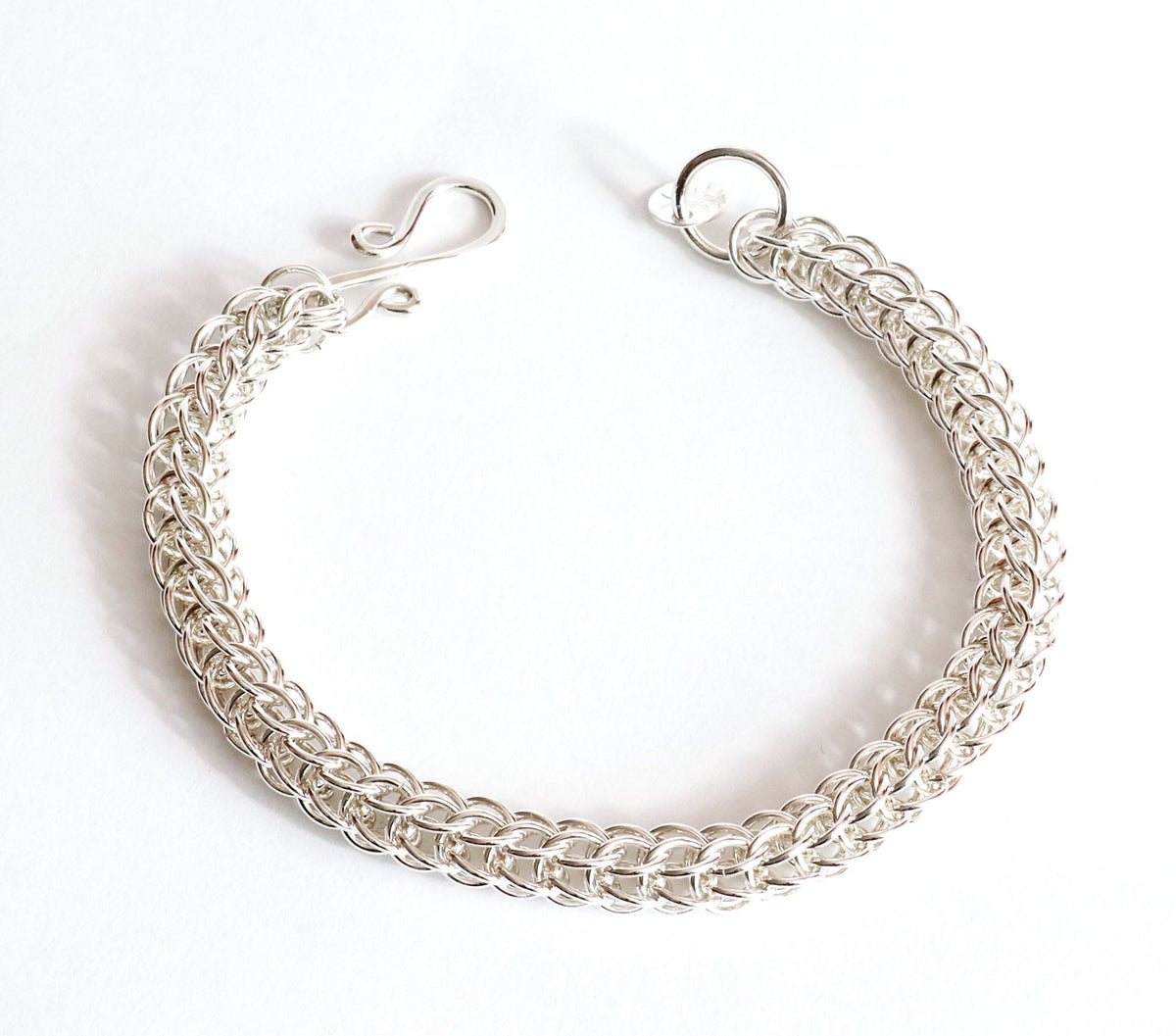 Handwoven Full Persian 6-in-1 Argentium 935 silver bracelet with handmade S-hook clasp shown on plain white background.