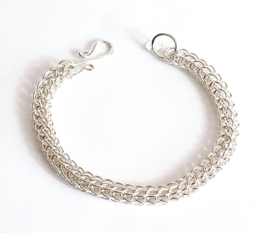 Handwoven Full Persian 6-in-1 Argentium 935 silver bracelet with handmade S-hook clasp shown on plain white background.