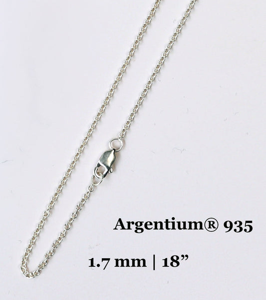 Silver chain necklace with Argentium 935 marking on a white background
