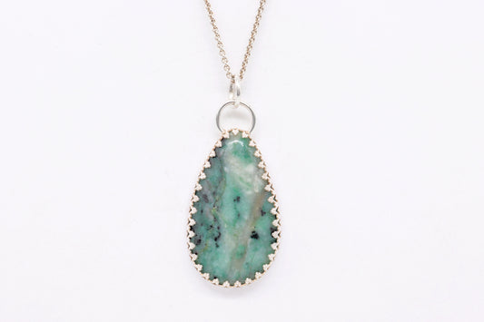 African Turquoise Jasper pendant necklace handcrafted in Argentium 935 silver on a white background.