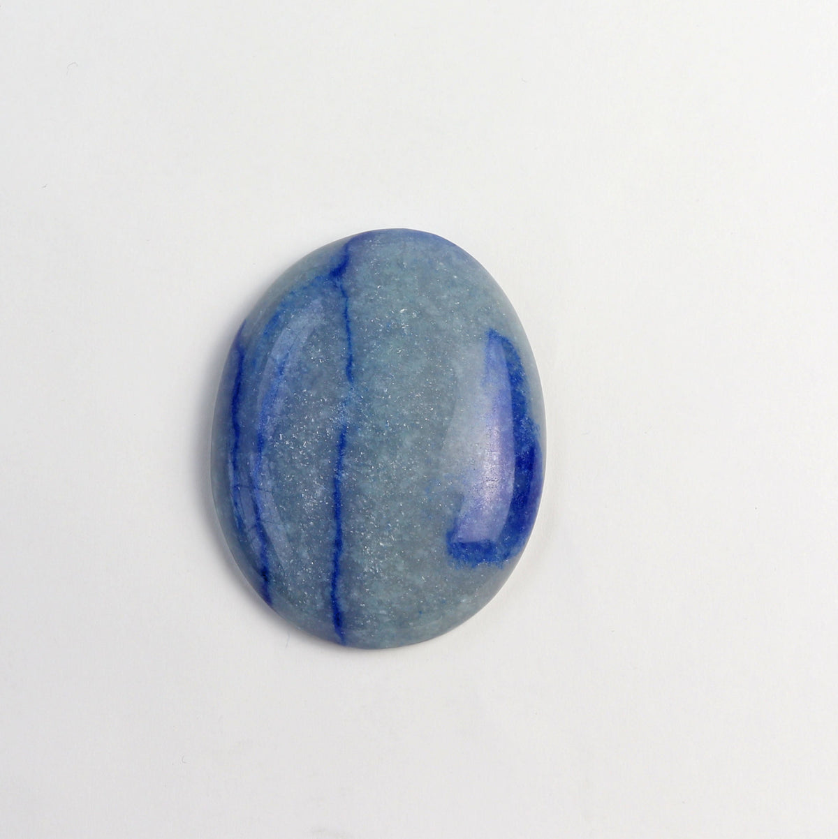 A polished oval Aventurine gemstone with a light blue-gray base and dark blue veining, displayed on a clean white background.