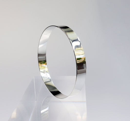 Argentium Bangle Bracelet shown against light gray background.