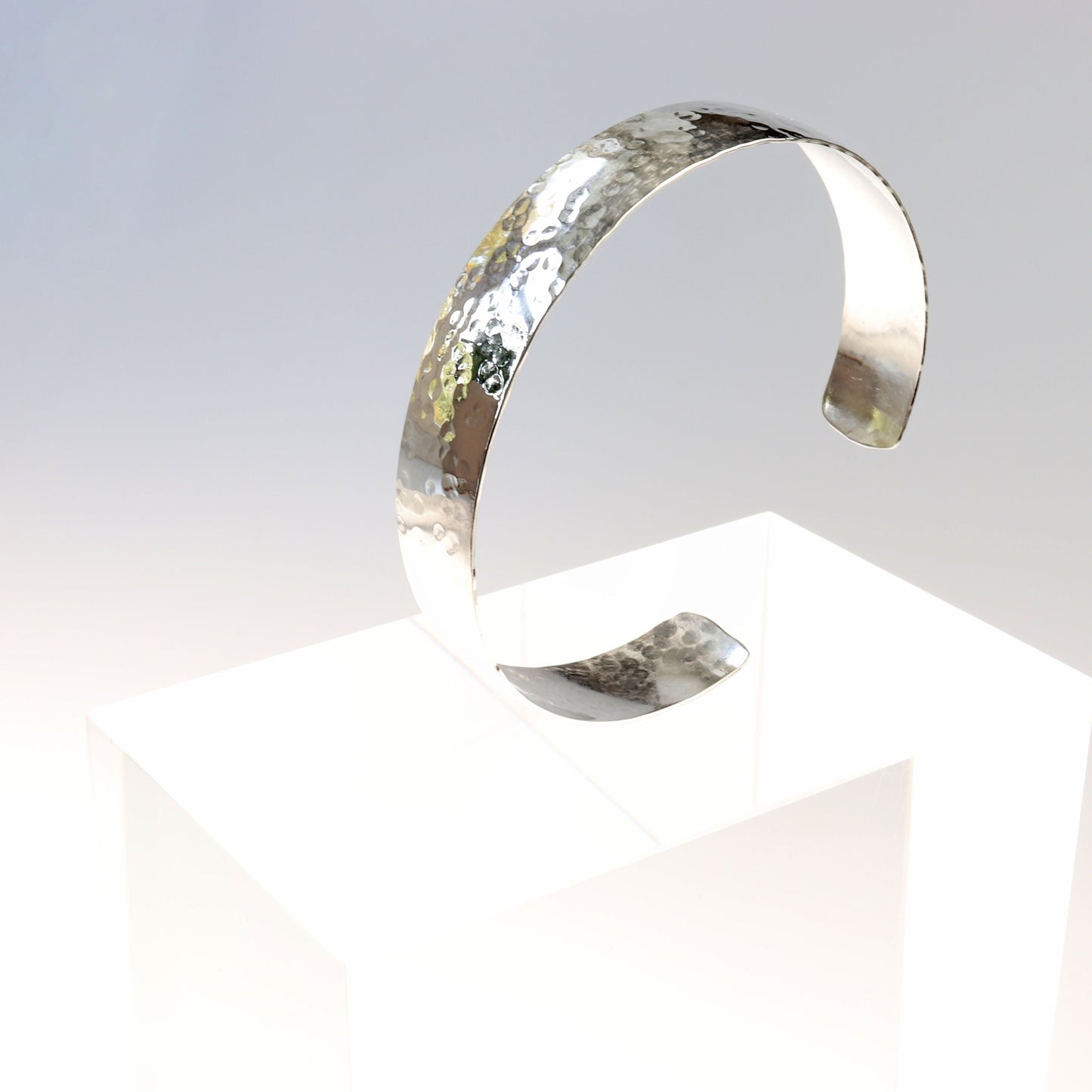 Handcrafted in USA is this synclastic hammered bump cuff bracelet in Argentium® 935 Silver—a premium, hypoallergenic, and tarnish-resistant metal that contains more silver than 925 Sterling Silver. Elevate your capsule jewelry collection with this outstanding addition.