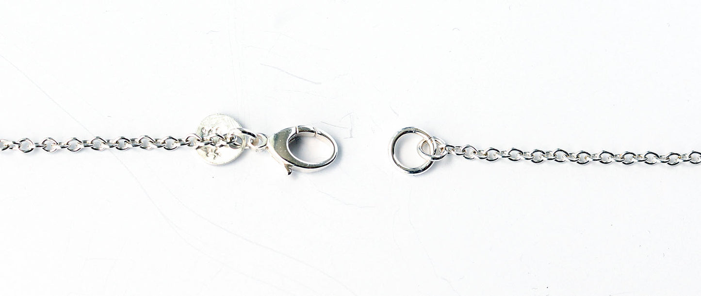 Closeup of sterling silver teardrop lobster clasp on 1.9 Argentium chain necklace on a white background.