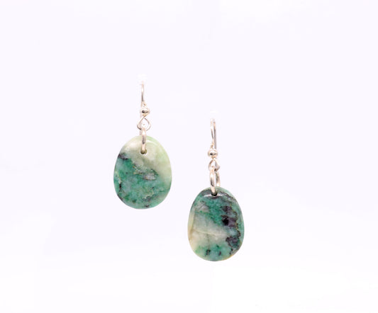 A pair of handmade African Turquoise jasper dangle earrings handcut shaped and polished to showcase the natural green and white marbled patterns finished with Argentium earwires displayed against a clean white background.