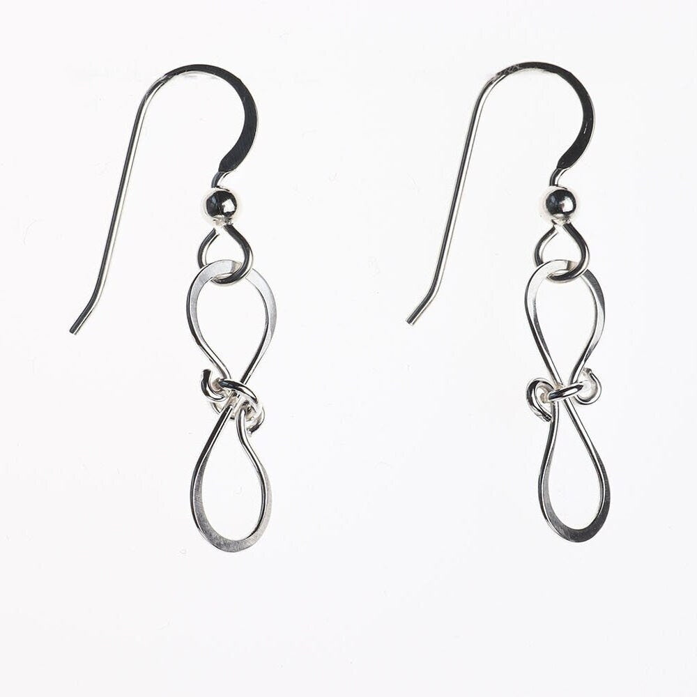 Solid Argentium 935 silver bow drop earrings handcrafted with linked bow-shaped loops shown against white background.