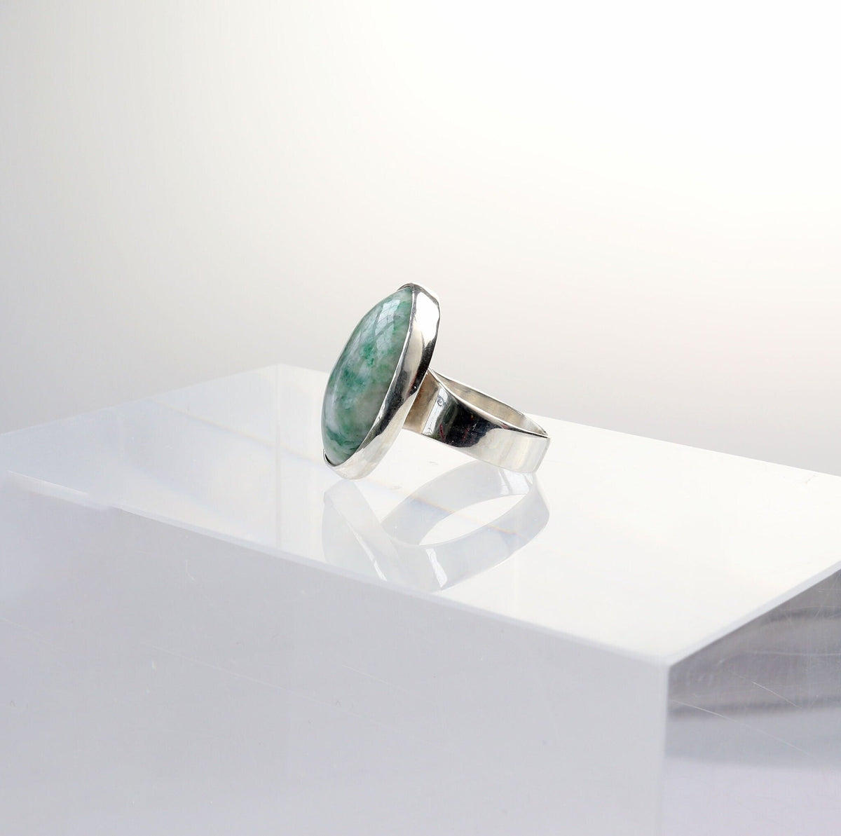 Side view of this Handcut Mariposite gemstone ring in polished Argentium 935 silver, size 7.75