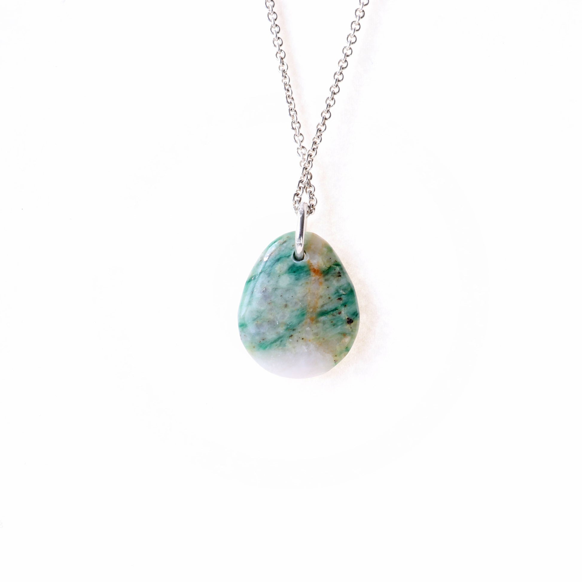 A stunning Mariposite gemstone pendant, handcrafted in Missouri, USA. This unique piece features a teardrop shape, handcut and polished on both sides to showcase the natural green and white hues of the Mariposite stone. 