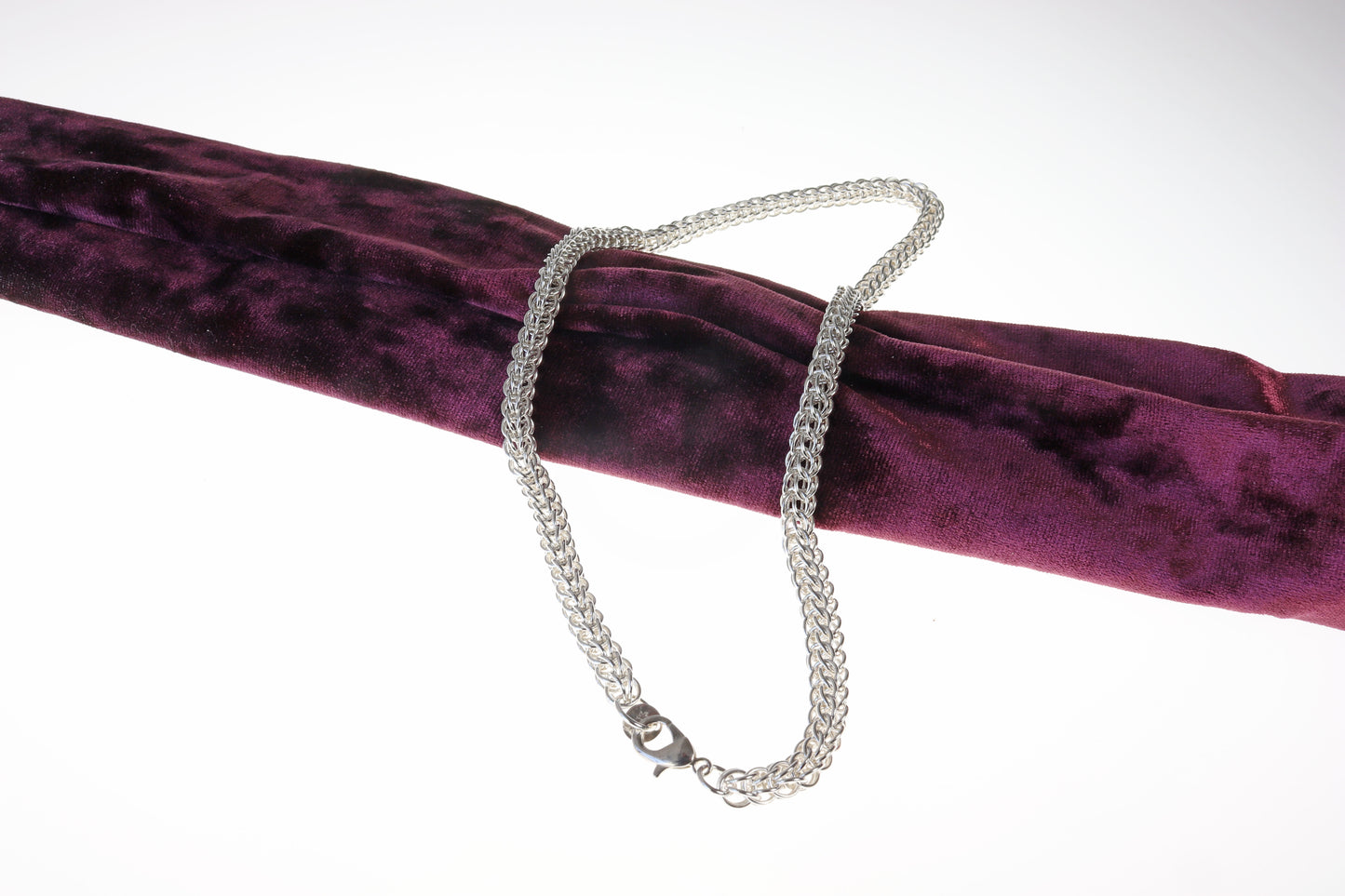 A Full Persian Weave necklace, a masterpiece of timeless craftsmanship. Handcrafted from over 400 precision-cut rings of premium 935 Argentium® Silver, this necklace offers exceptional tarnish resistance and hypoallergenic properties, making it a superior choice for both durability and everyday elegance.