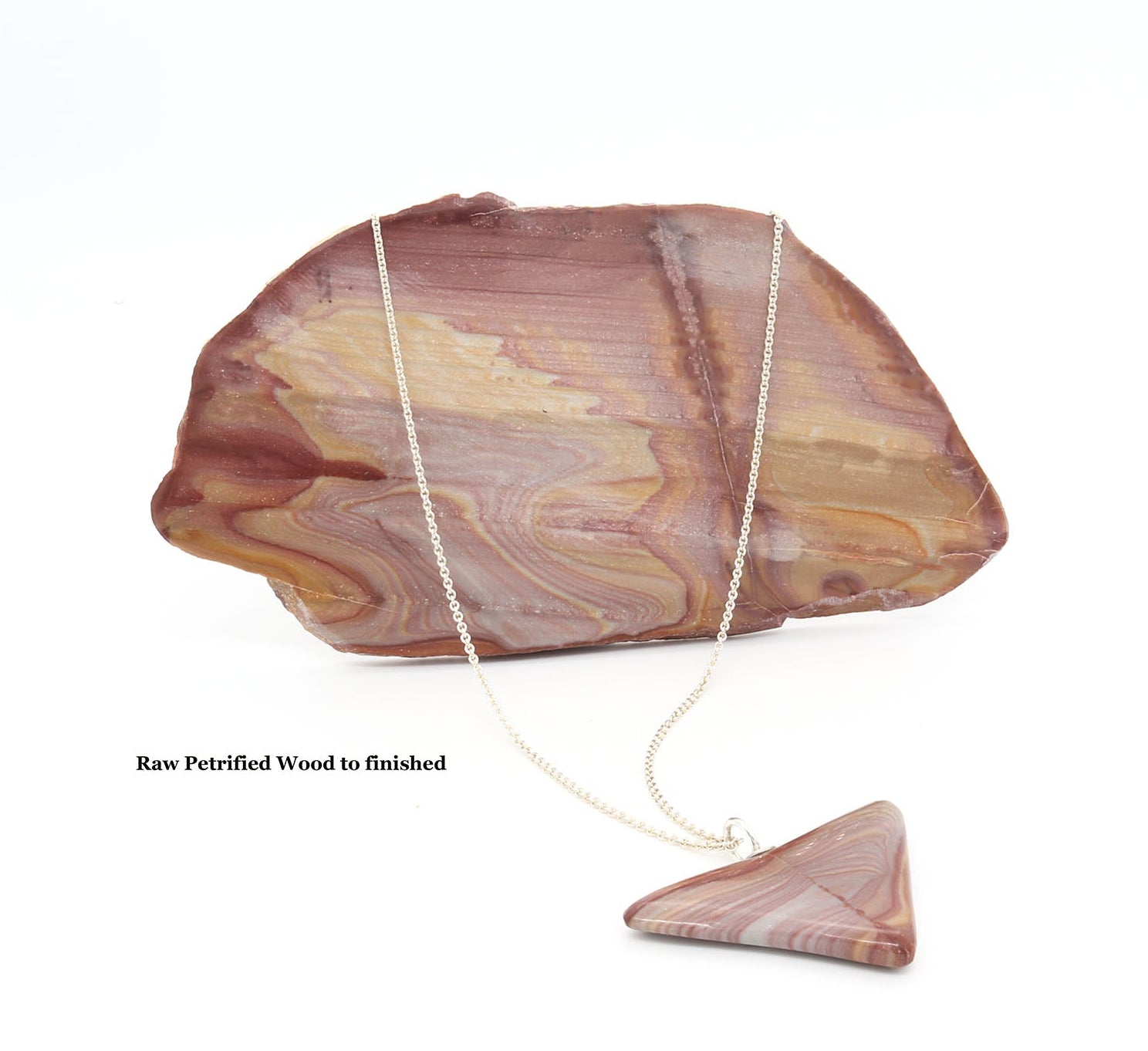Raw Petrified Rainbow wood next to finished pendant shown against white background.
