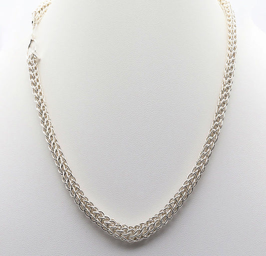 A Full Persian Weave necklace, a masterpiece of timeless craftsmanship. Handcrafted from over 400 precision-cut rings of premium 935 Argentium® Silver, this necklace offers exceptional tarnish resistance and hypoallergenic properties, making it a superior choice for both durability and everyday elegance.