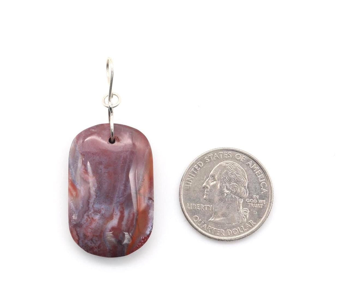 Red Mexico agate pendant next to US quarter for scale of size.