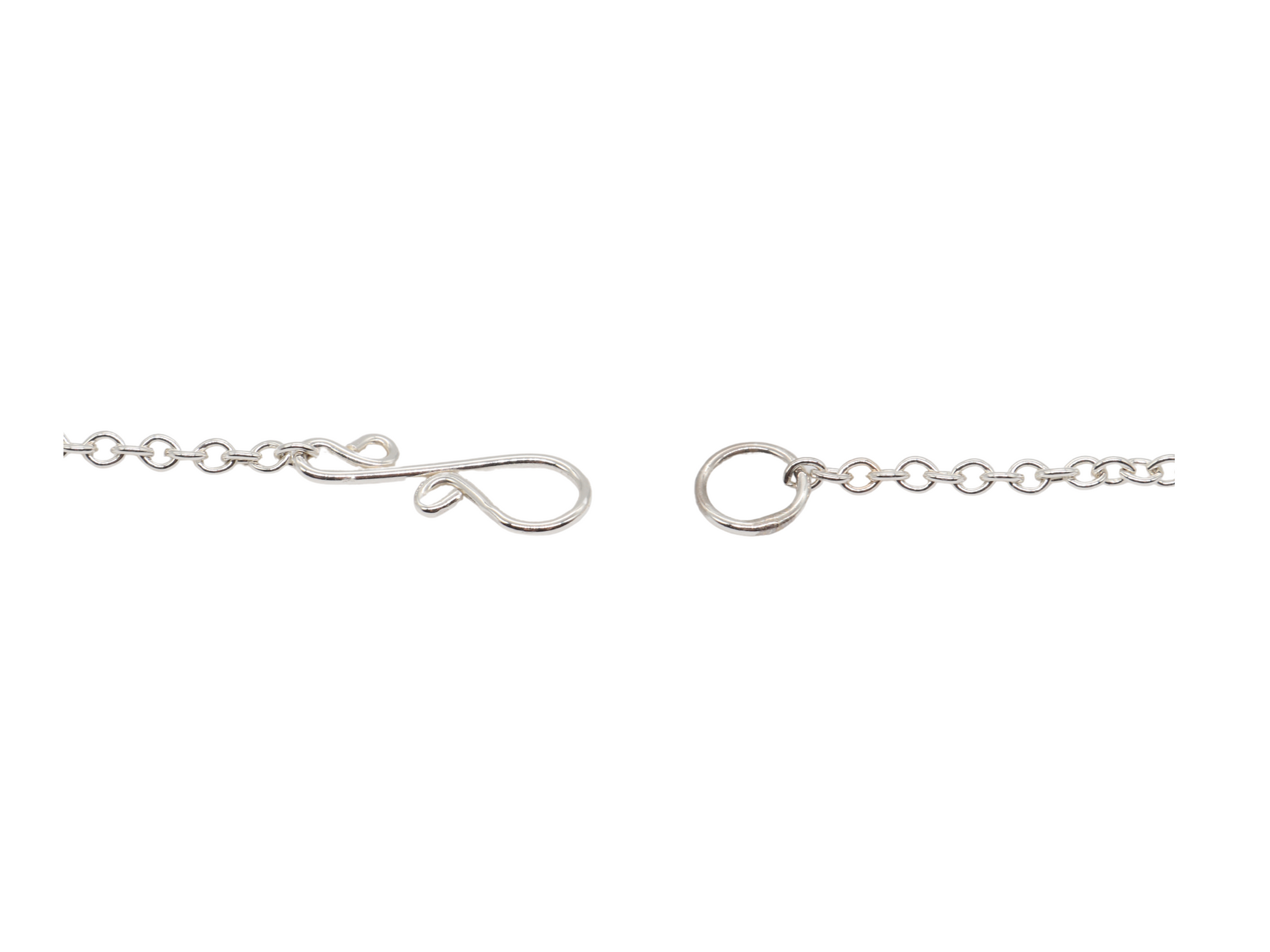 Closeup of s-hook clasp in Argentium Silver on white background.