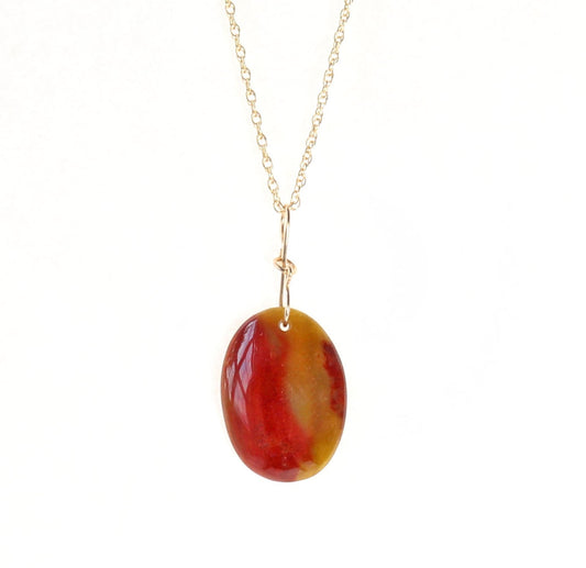 Natural Sonoran Sunrise pendant. Featuring a unique blend of deep red cuprite, warm mustard ochre, and rare olive-chartreuse tones, paired with a gold-fill rope style chain shown on white background.