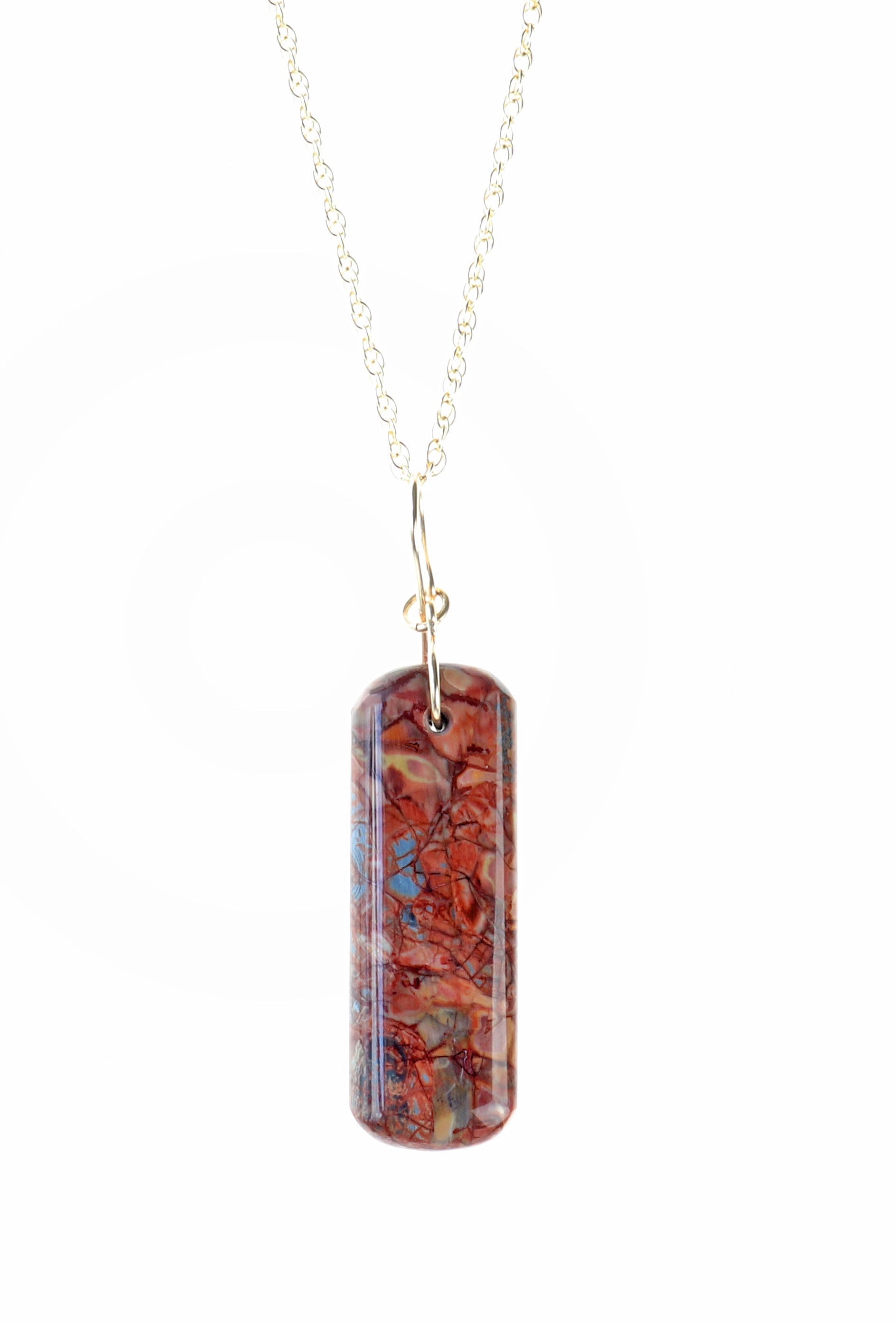 Stony Creek Jasper pendant  hand-cut and polished features bold red and deep blue patterns suspended from a handcrafted 14/20 Yellow Gold-Filled Infinity Bow Bail with optional Gold-Filled Rope chain against white background.