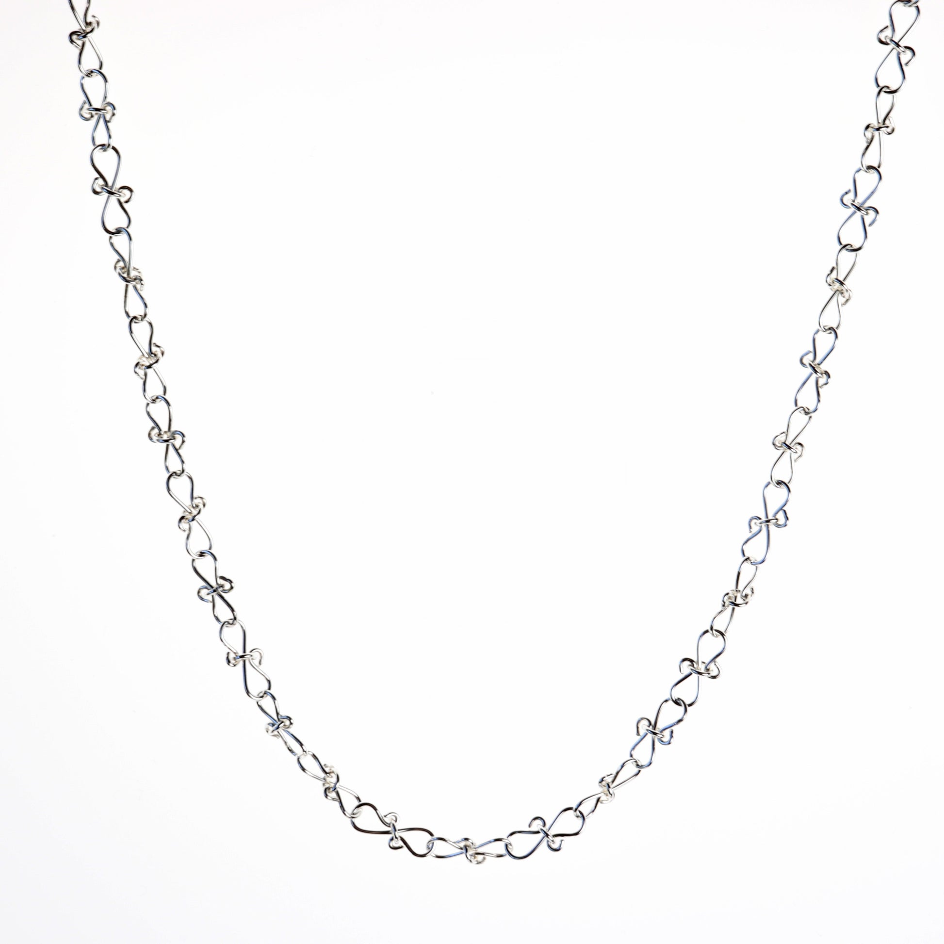 Adjustable Infinity bow shaped 18" Necklace.  Handcrafted in our Missouri studio, using solid 20 Gauge sterling 935 Argentium silver to create a piece that displays elegance and quality. 