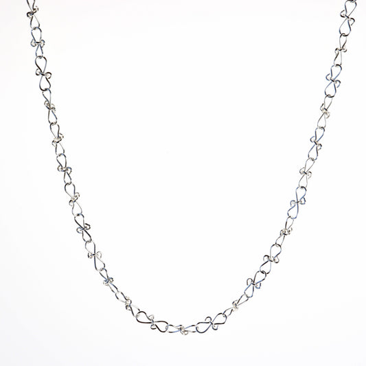 Adjustable Infinity bow shaped 18" Necklace.  Handcrafted in our Missouri studio, using solid 20 Gauge sterling 935 Argentium silver to create a piece that displays elegance and quality. 