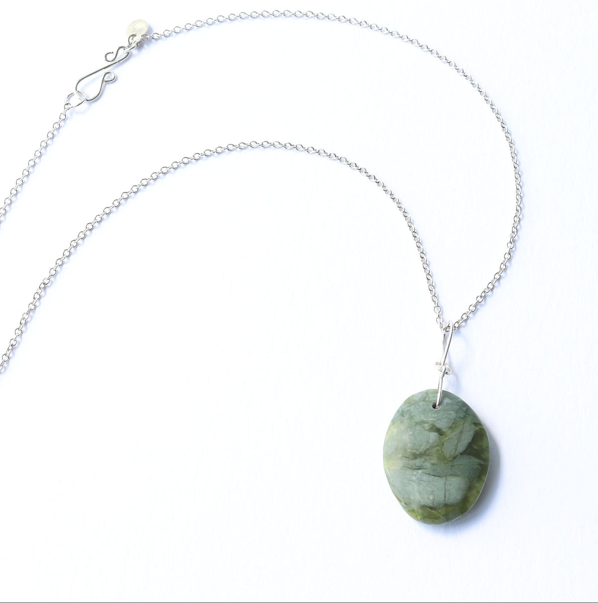 An Argentium silver chain necklace featuring a polished,California Jade stone pendant with natural marbled patterns, displayed on a clean white background.