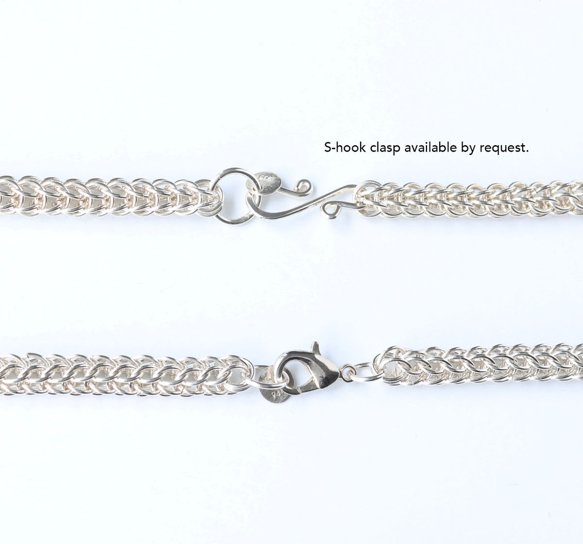 Close-up of an Argentium silver persian weave chain necklace showing two clasp options: a decorative ring-and-hook clasp in Argentium on the top and a standard sterling silver teardrop lobster clasp on the bottom, with text reading 'S-hook clasp available by request.' on a plain white background.