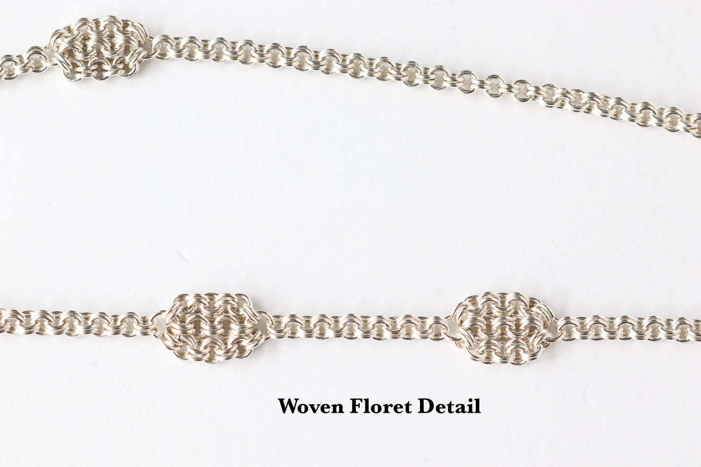 Closeup of woven floret detail on a white background