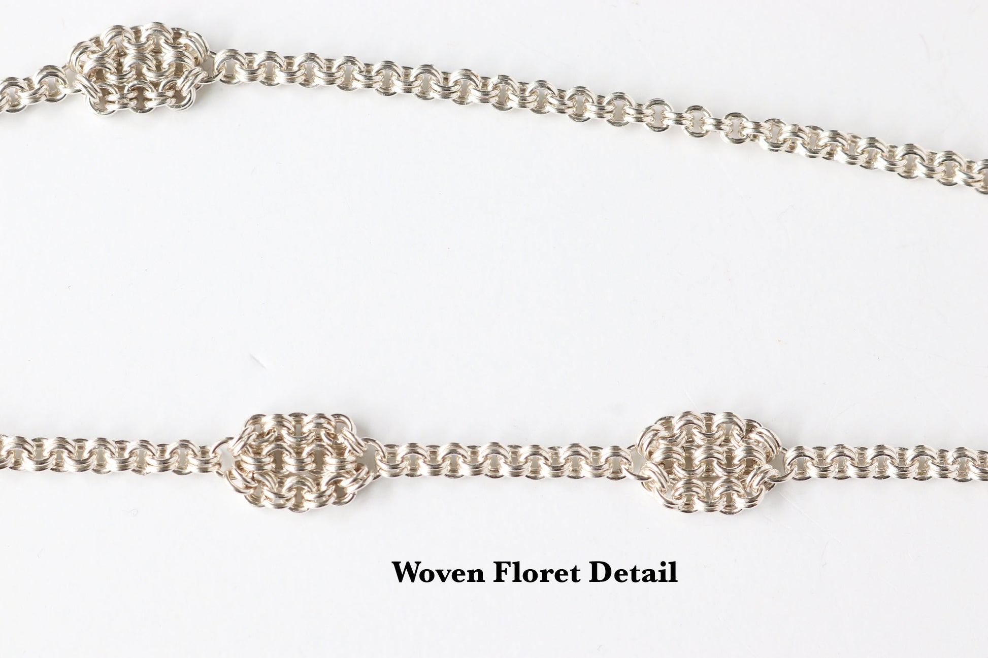 Closeup of woven floret detail on a white background