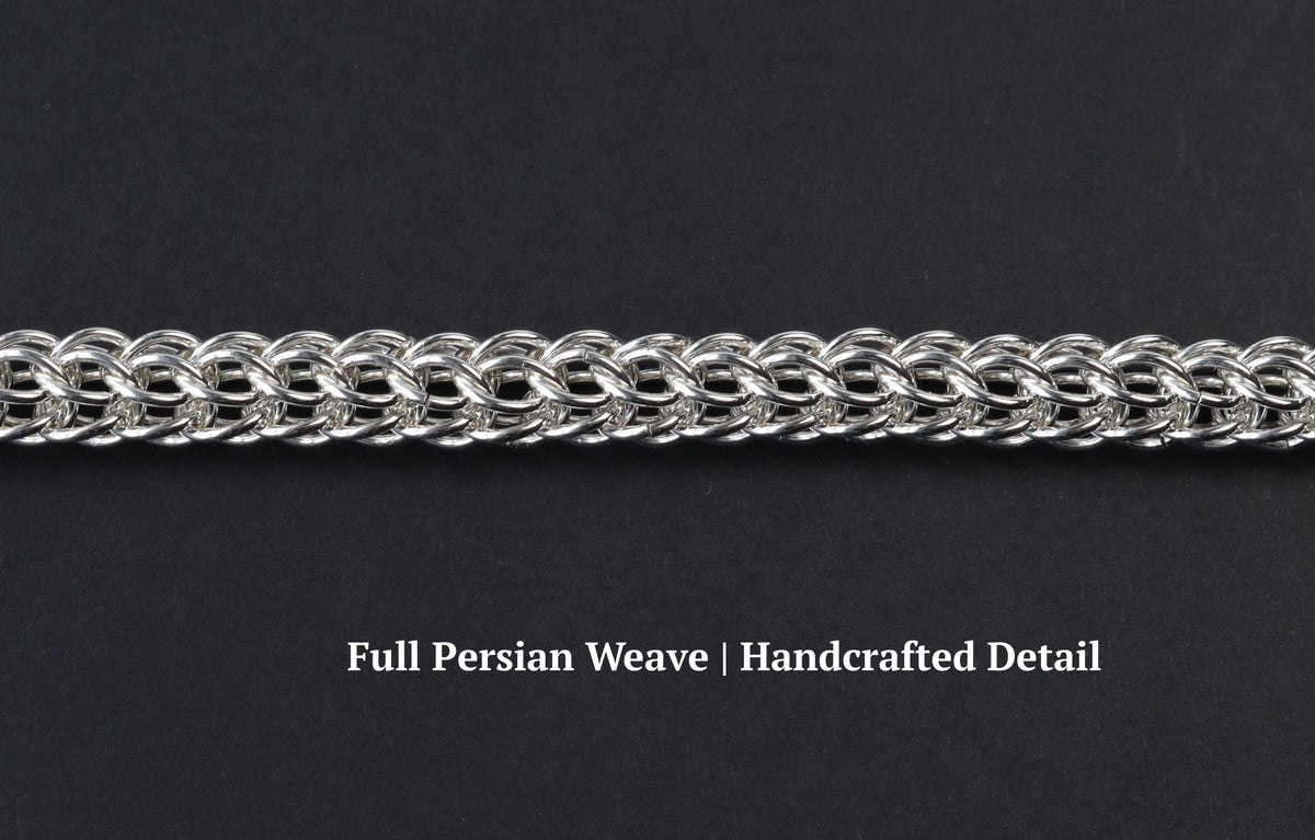 A close-up of an persian weave necklace in Argentium silver, displayed horizontally against a dark textured background with descriptive text overlay. 'Full Persian Weave|Handcrafted Detail'