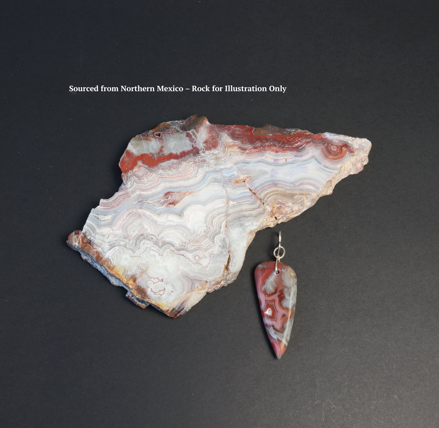 Crazy Lace Agate arrow shaped gemstone pendant. Shown next to raw crazy lace agate stone used to craft the pendant.