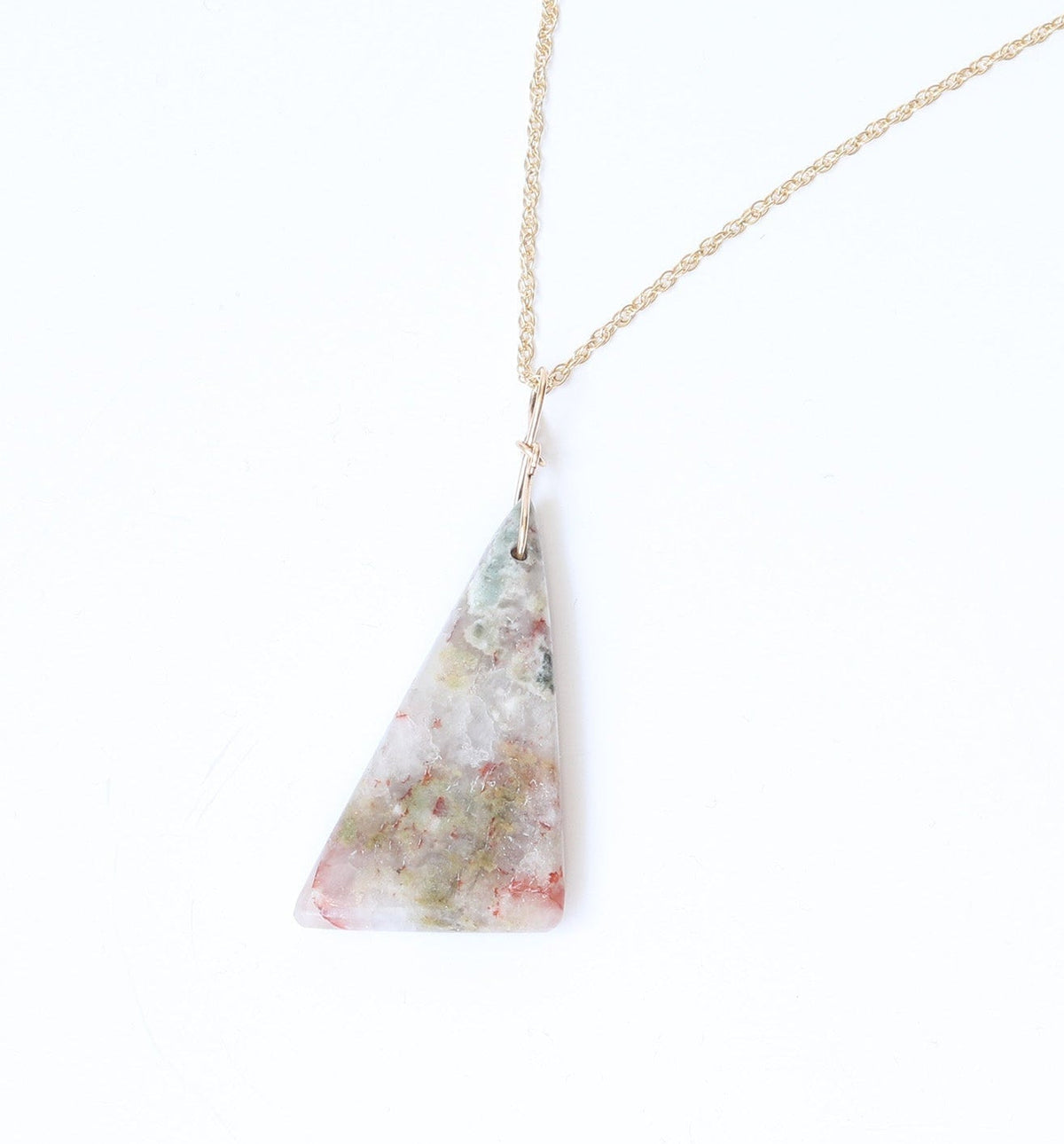 Necklace with a triangular pendant on a white background