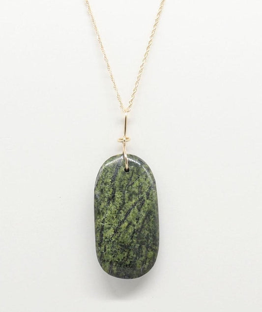 A Forest Green Jasper Pendant suspended from gold-filled rope chain necklace against light gray background.