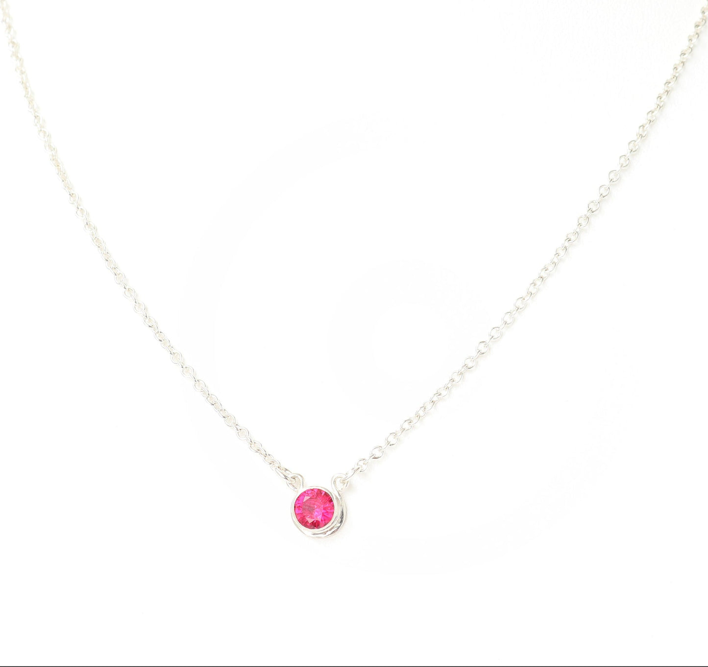 Handcrafted 6mm lab ruby necklace set in Argentium silver.