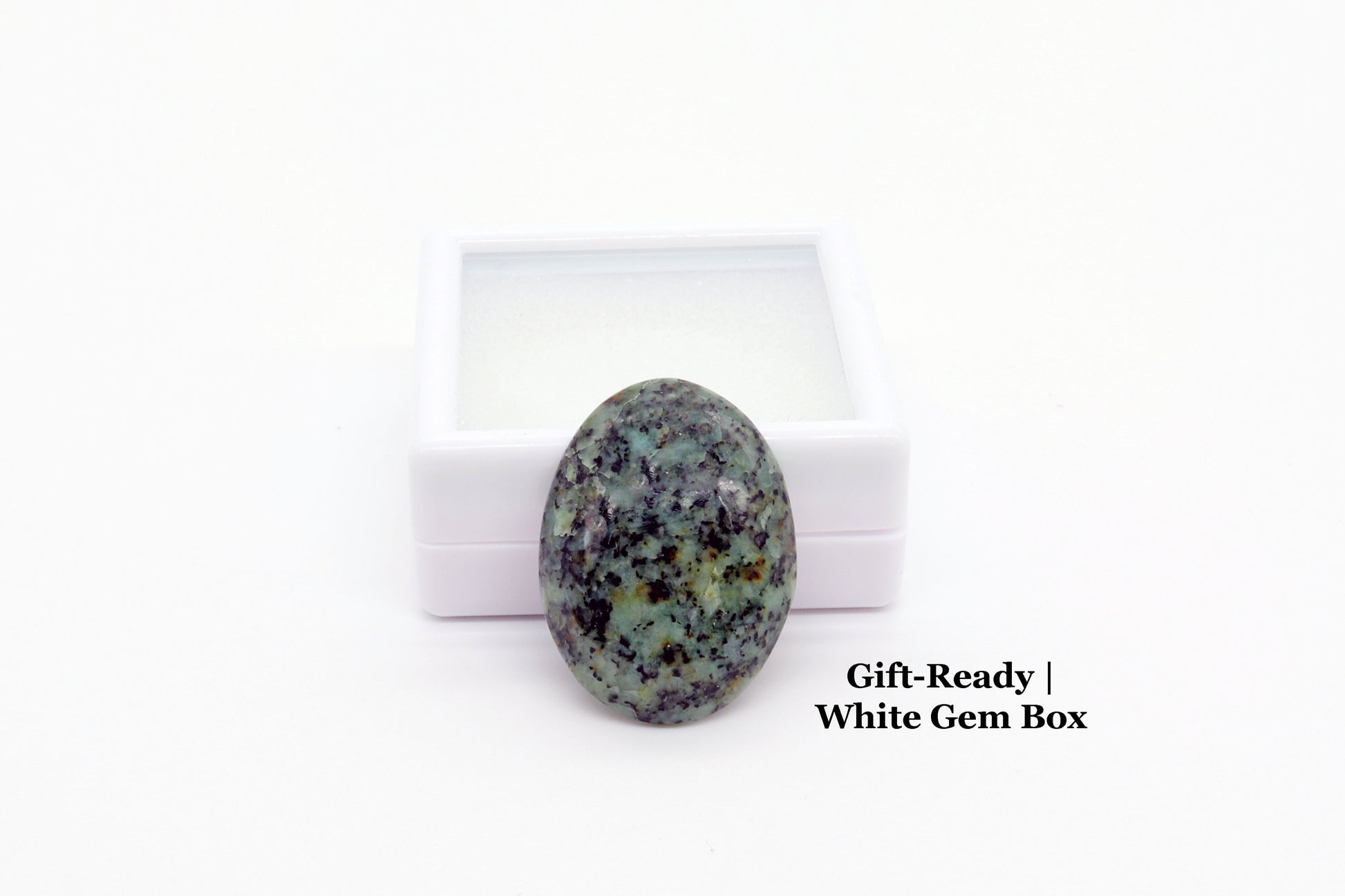 Gift Ready Fraser River Turquoise Cab next to white gem box included for storage or gifting.