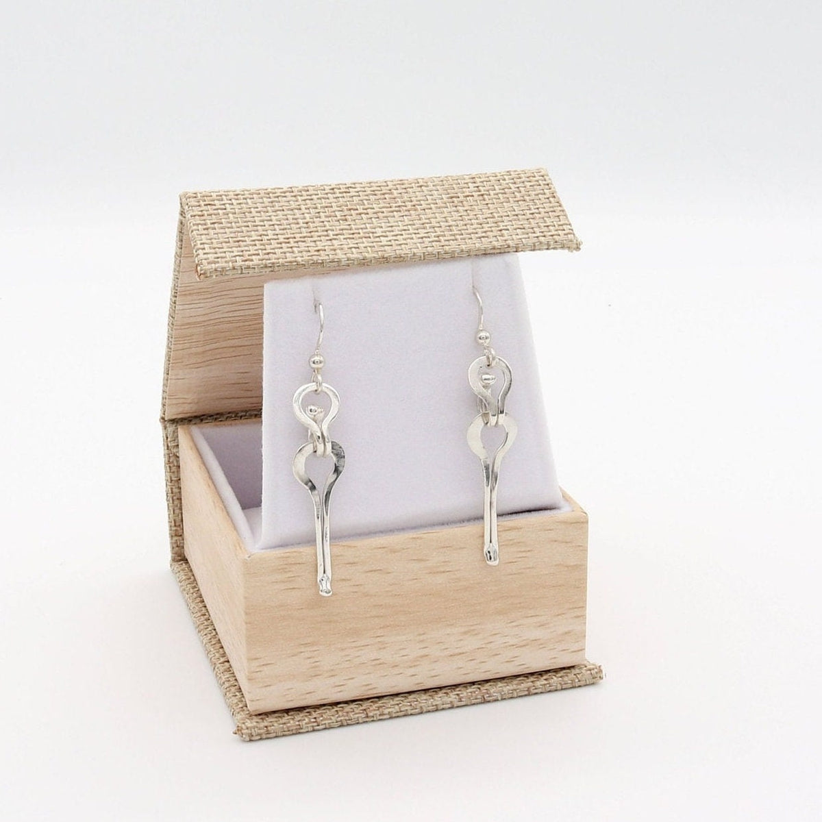Handmade Argentium solid silver keyhole drop earrings finished with Argentium® Silver ear wires shown on white background.  Ready to gift in eco friendly gift box. 