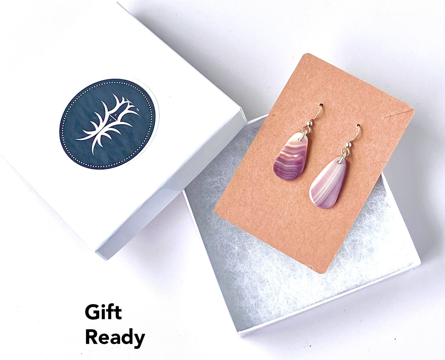 Earrings are shipped in our signature gift box shown against a white background.